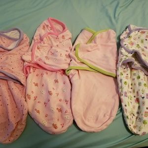 Lot of baby swaddles.  Sm/med