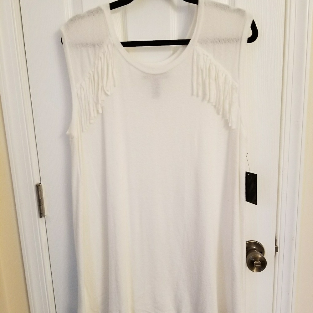 White fringe sleeveless top.