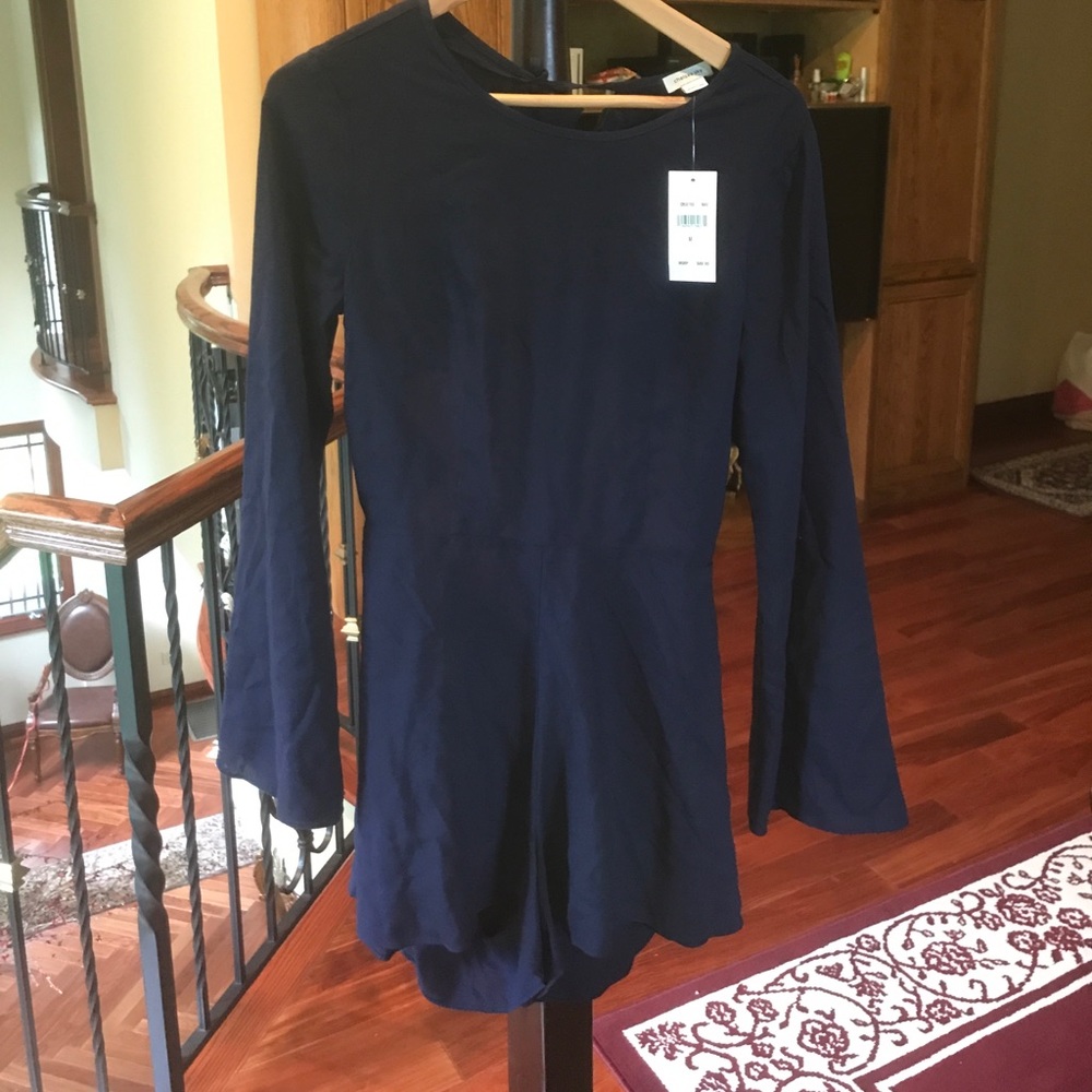 Chelsea Sky Navy romper with ruffled open back