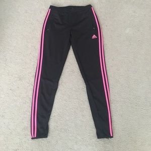 Trendy Adidas track pants with pink stripes