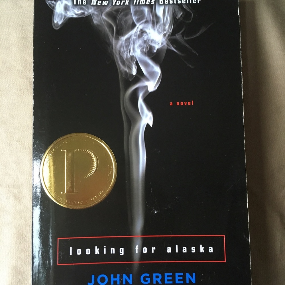 Soft covered John Green book.