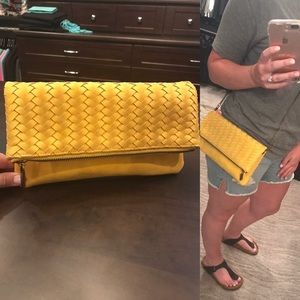 Yellow suede convertible bag.