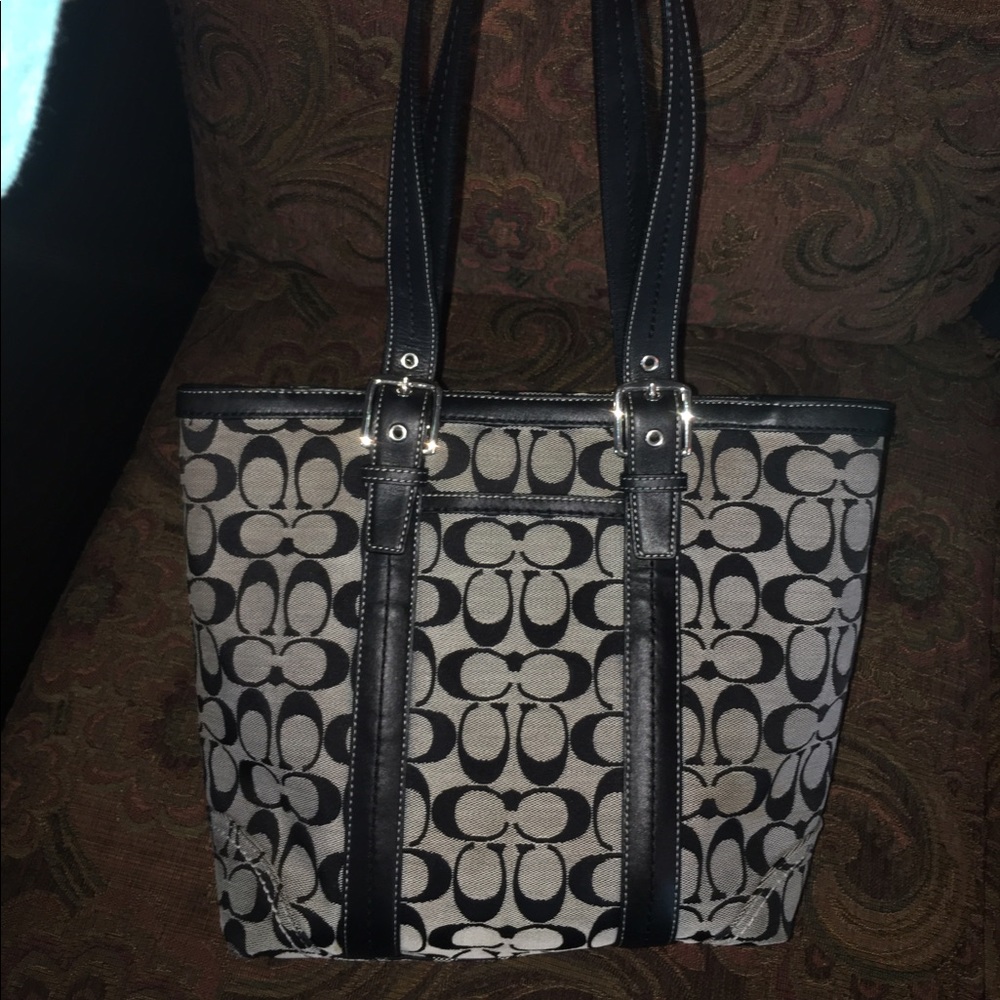 Used coach purse with light stains and wear