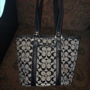 Used coach purse with light stains and wear
