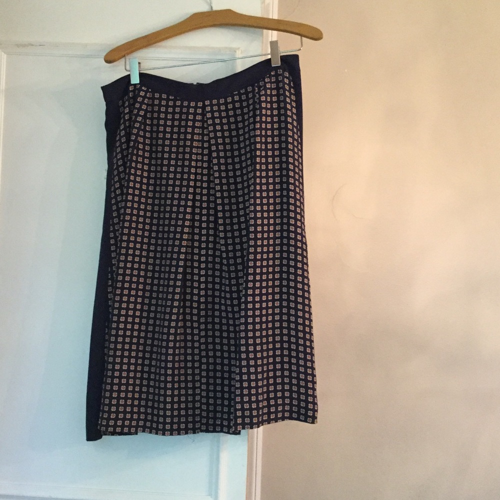 Navy blue with red and cream skirt
