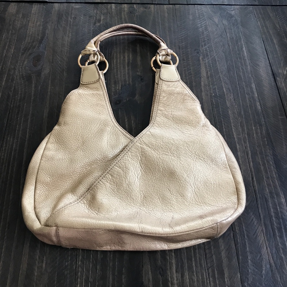 Gold fossil leather hobo Metallic purse bag.