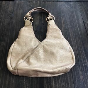 Gold fossil leather hobo Metallic purse bag.