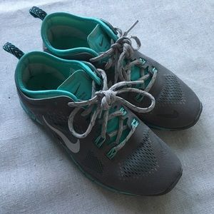 Grey and blue Nikes Size 6