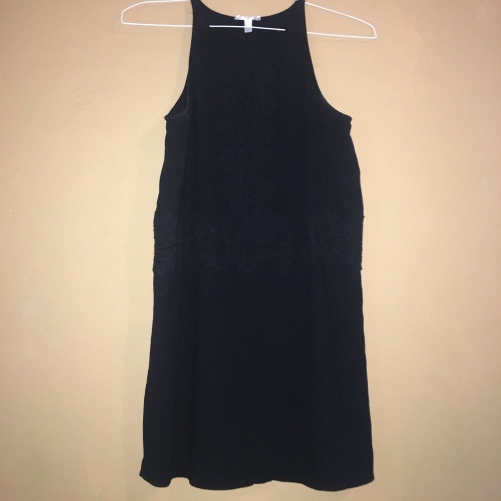 Short black dress with black lace detail