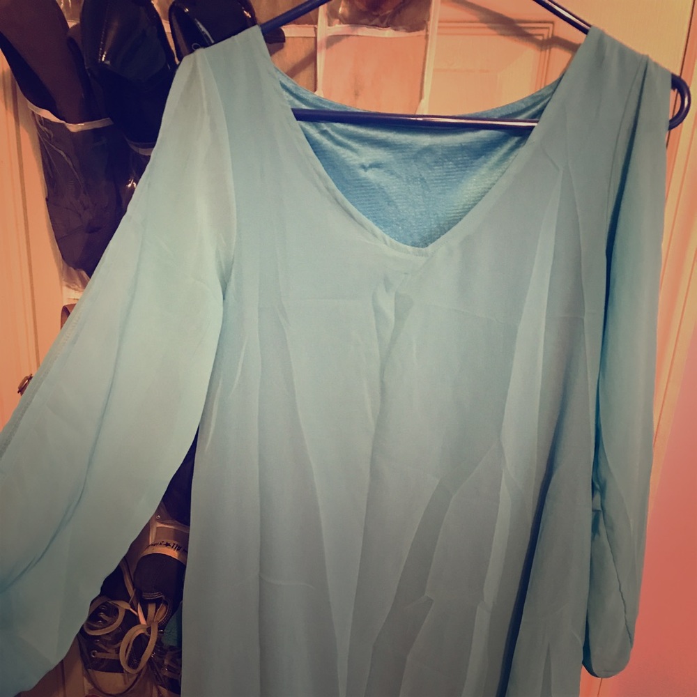 Light blue sheer blouse with slits in sleeve