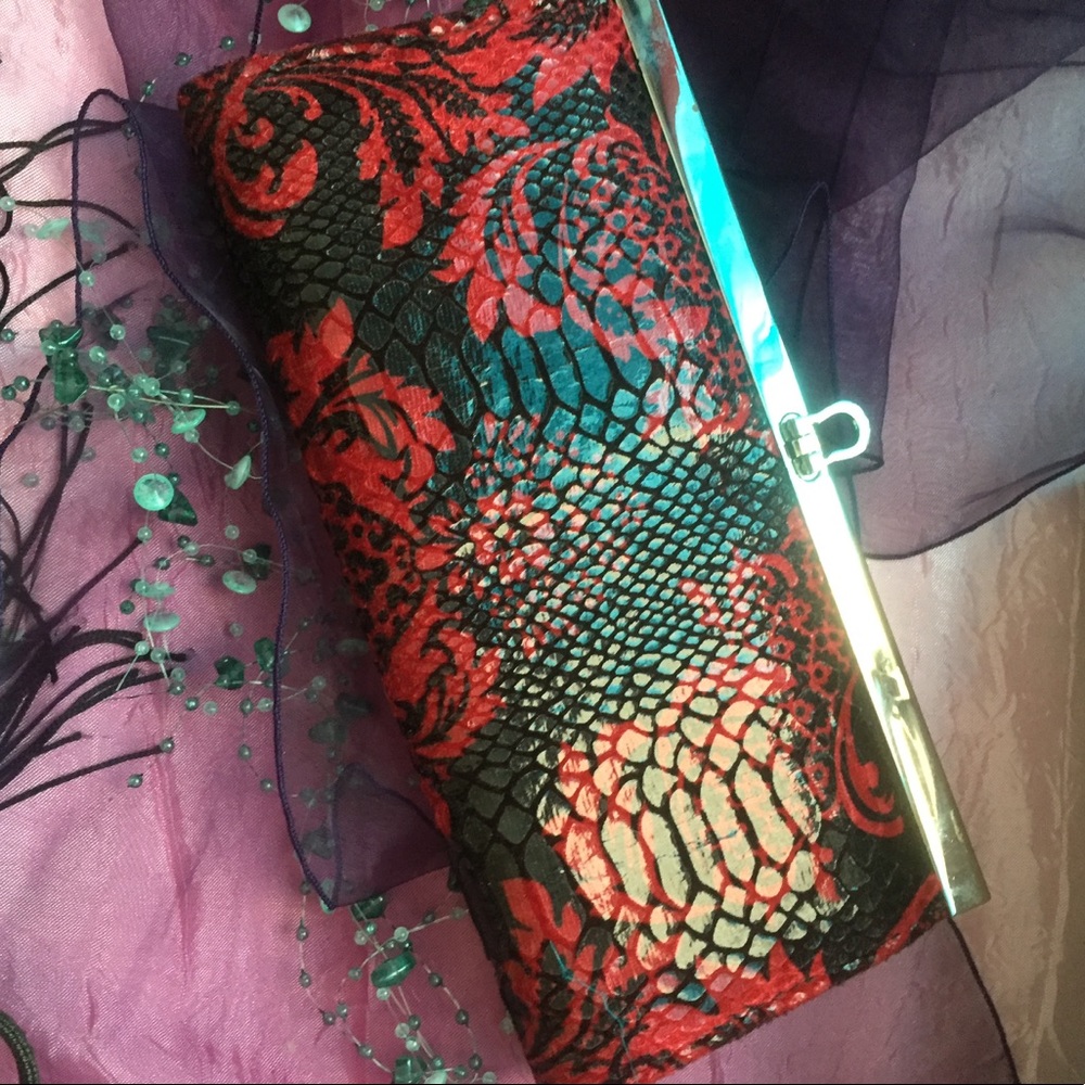 Black and red flowered clutch