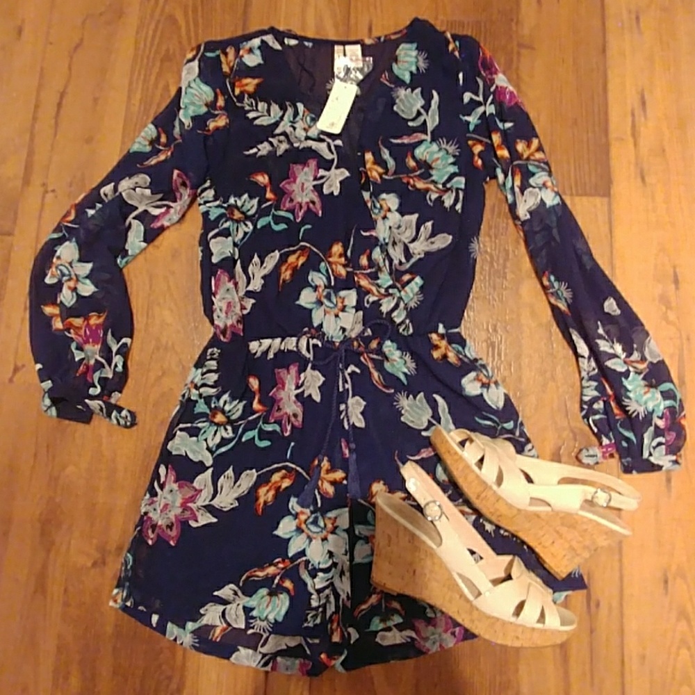 Gorgeous floral romper with navy background.