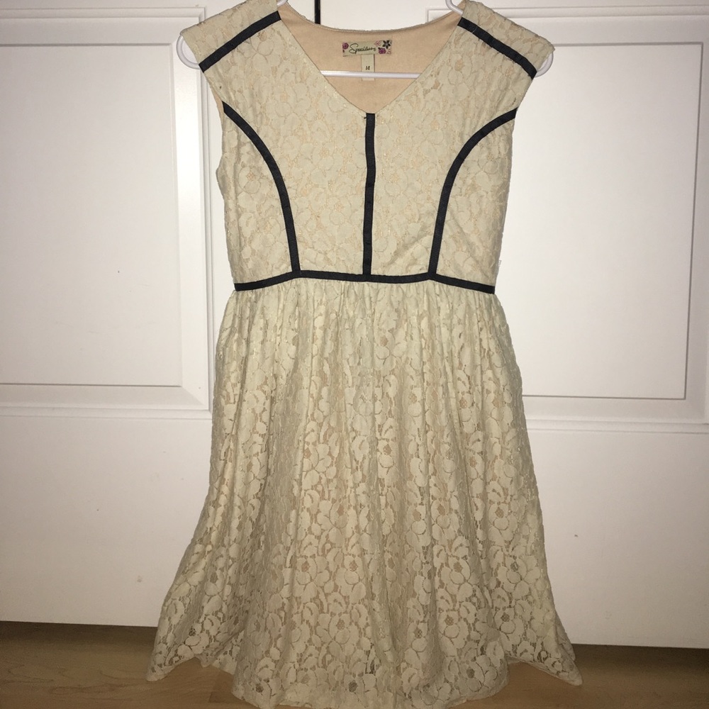 cream lace dress with black ribbon details