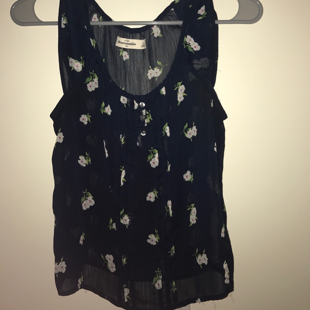 Blue shirt with white flowers.