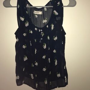 Blue shirt with white flowers.