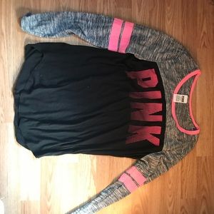 a black based shirt with the letters PINK