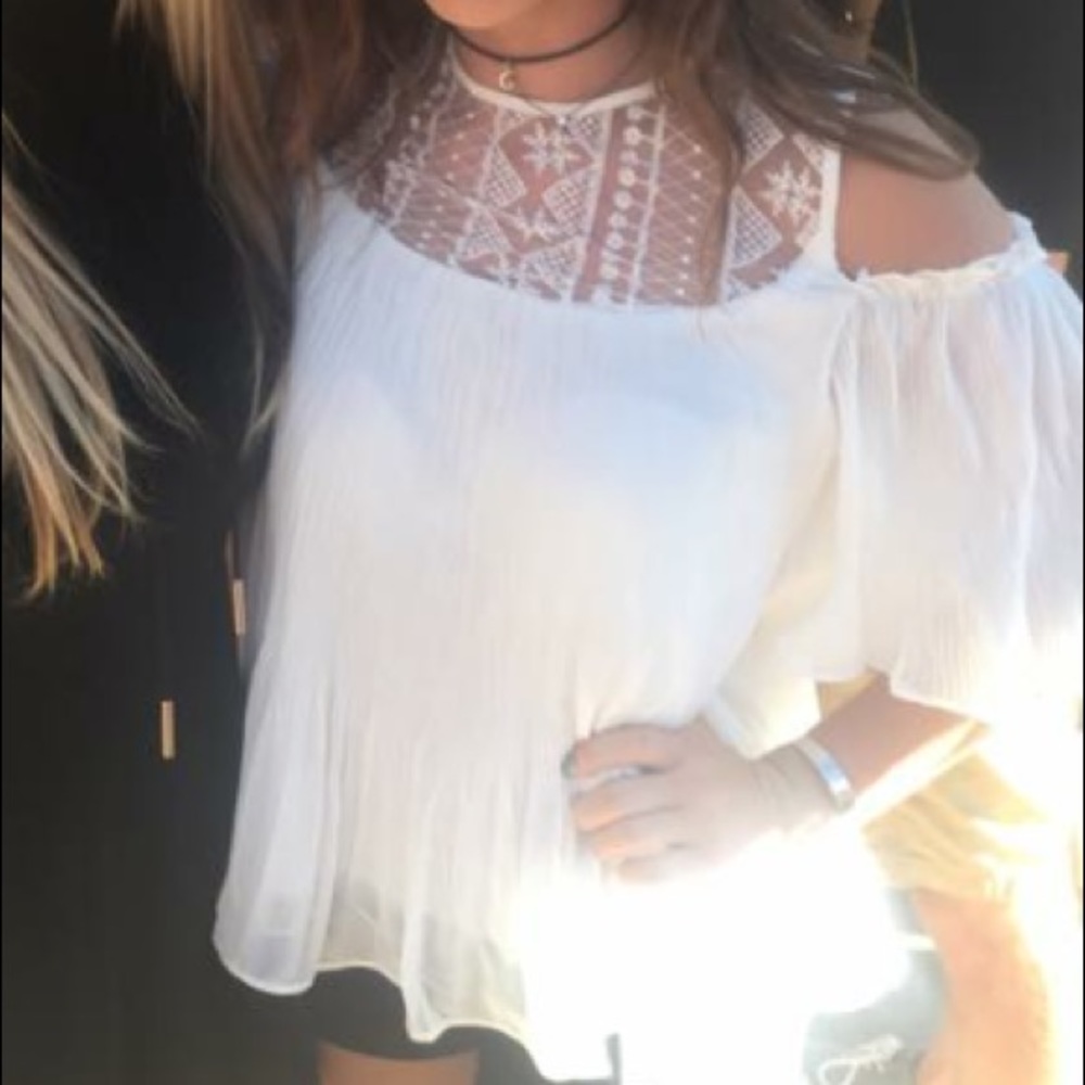 White shoulderless top.