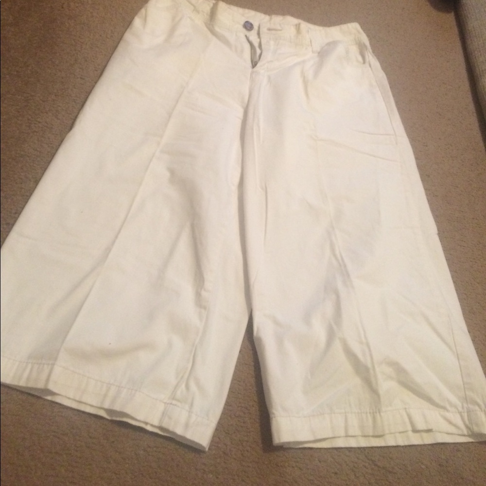 White capris with teal thread