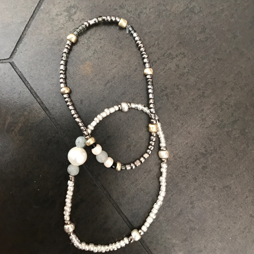 two stretchy, beaded bracelets