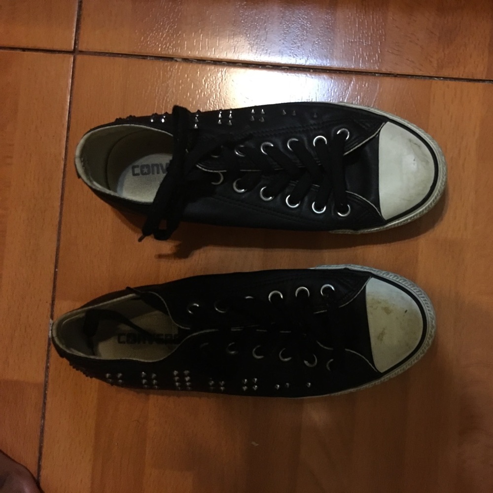 Black converses with sliver spikes on the side.
