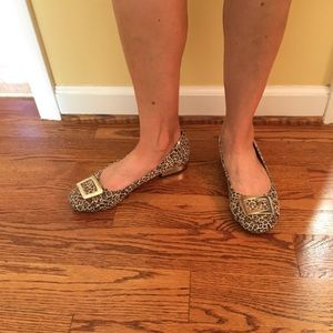Leather animal print flats with gold buckle.