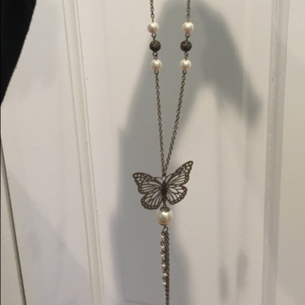 Long beaded butterfly pendant necklace