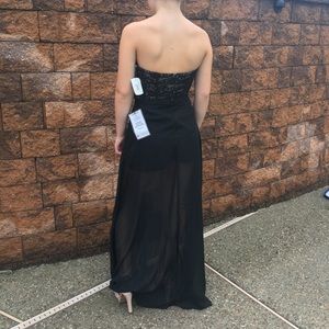 Elegant black dressy romper with lace overlay