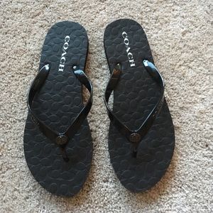 Coach black flip flops.