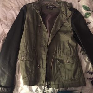 Green utility jacket with black leather sleeves