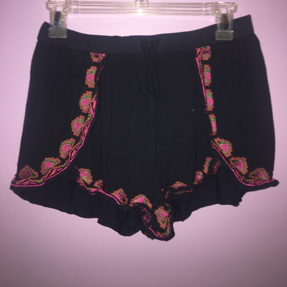 Navy blue shorts with tribal pattern bottoms