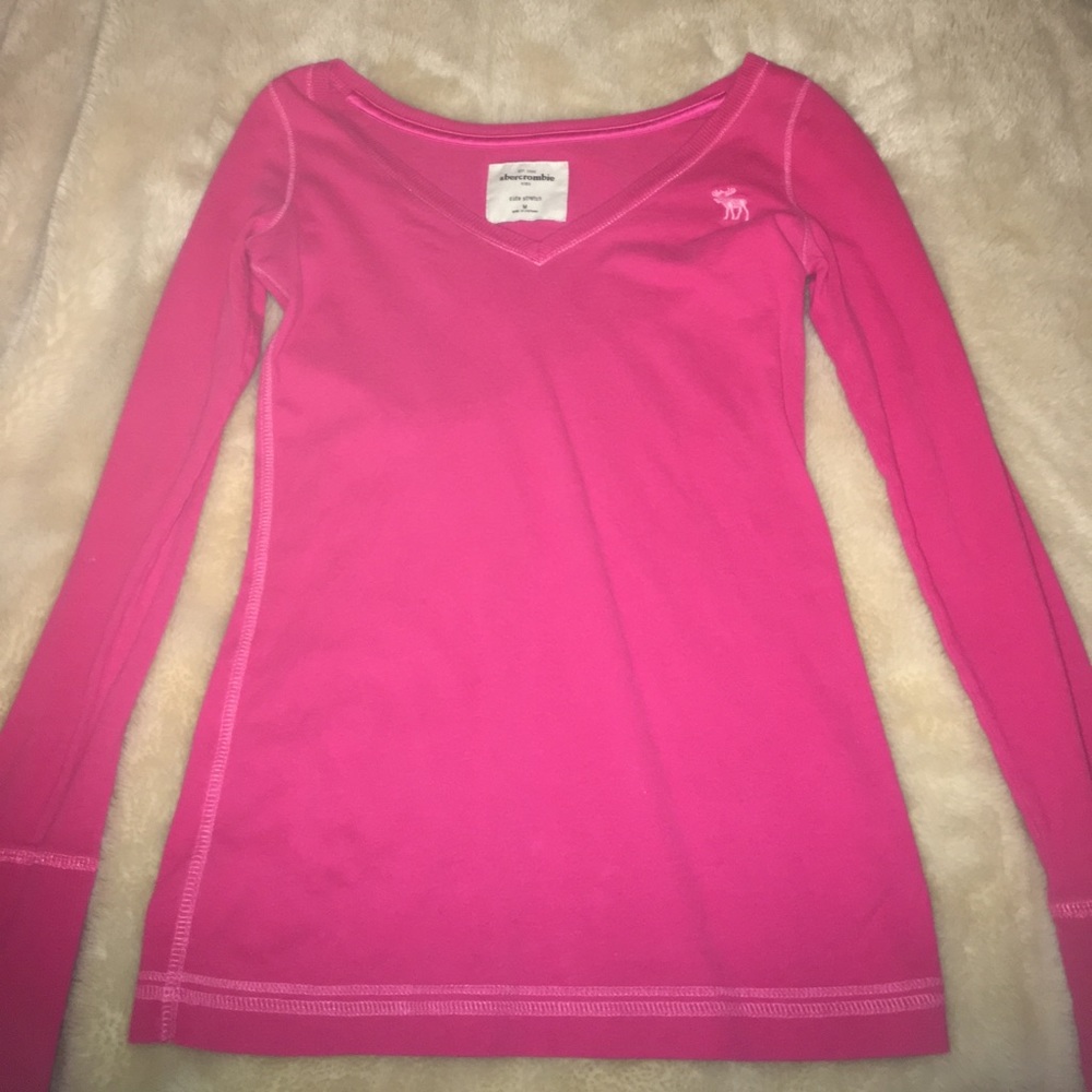 a pink, long sleeve, "cute stretch", top
