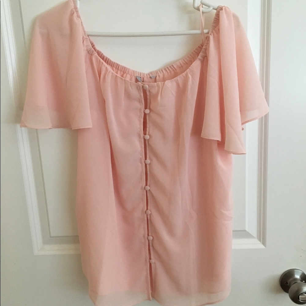 Off shoulder pink blouse.