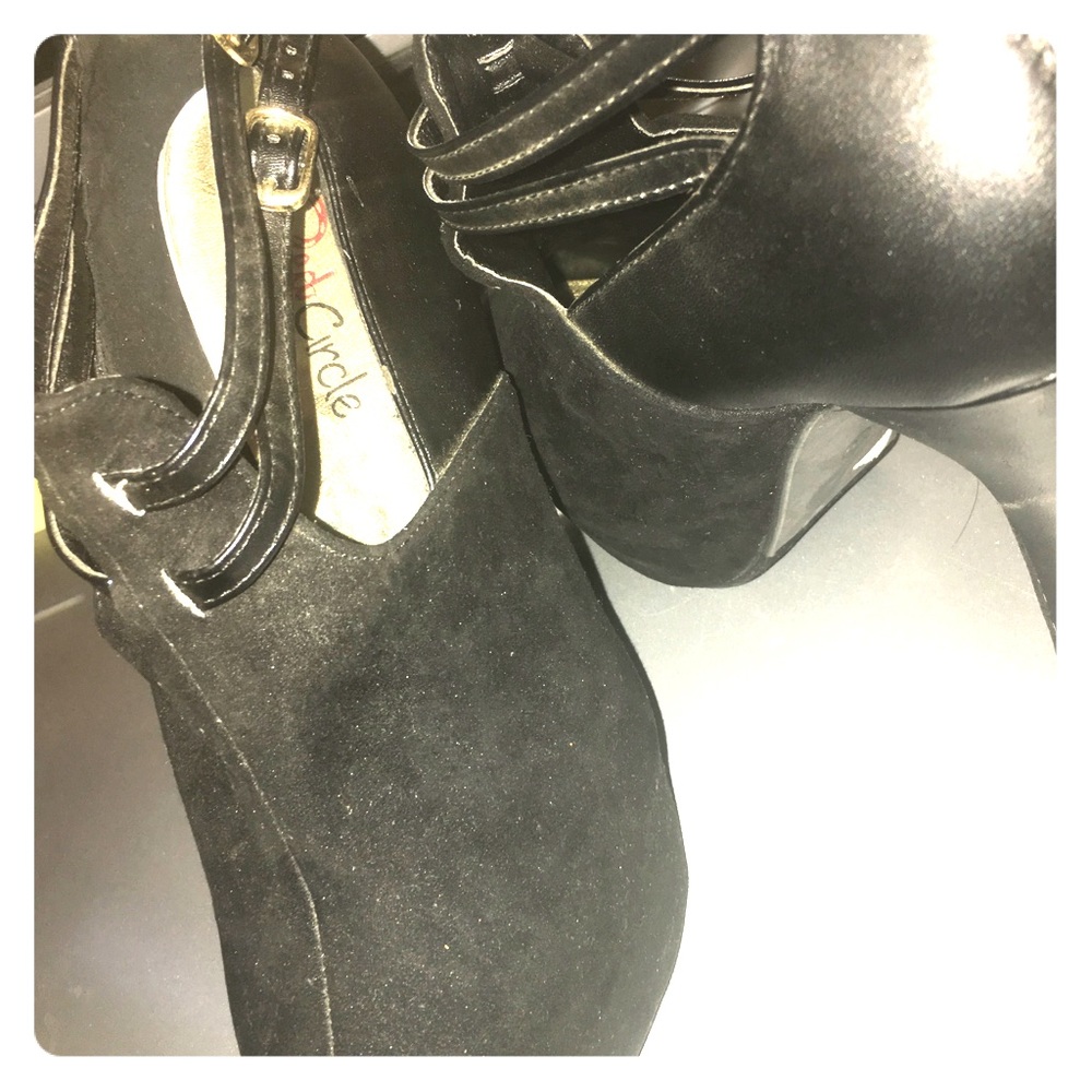 Black it's half suede and leather high heels