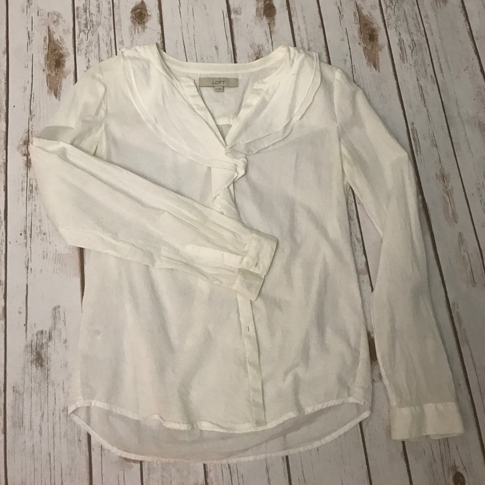 White button down with ruffle detail