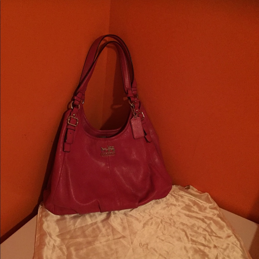 A fuchsia coach handbag.
