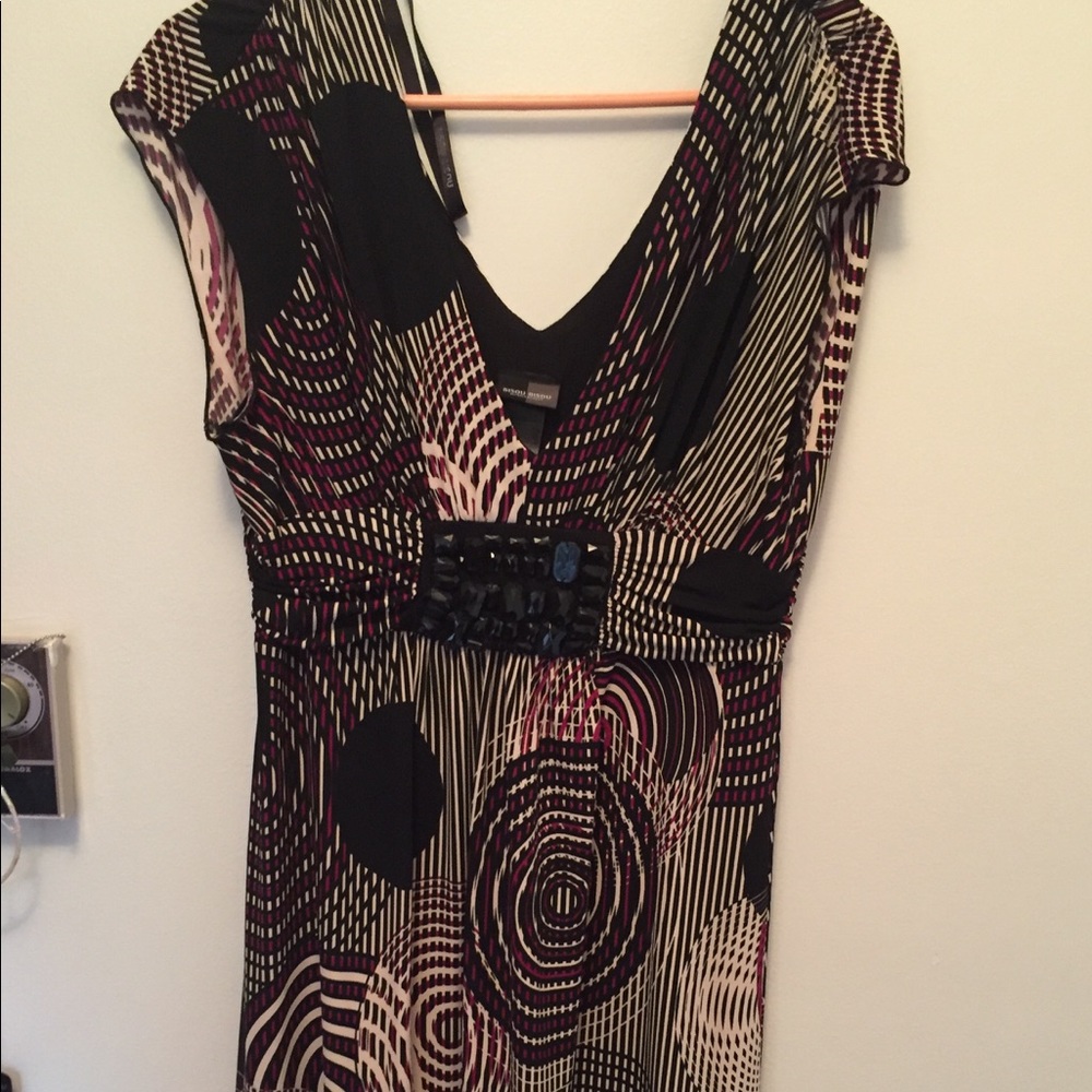 Very flattering stretchy dress.  Size 14
