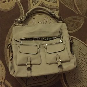 Maurice's cream with black stitching hand bag