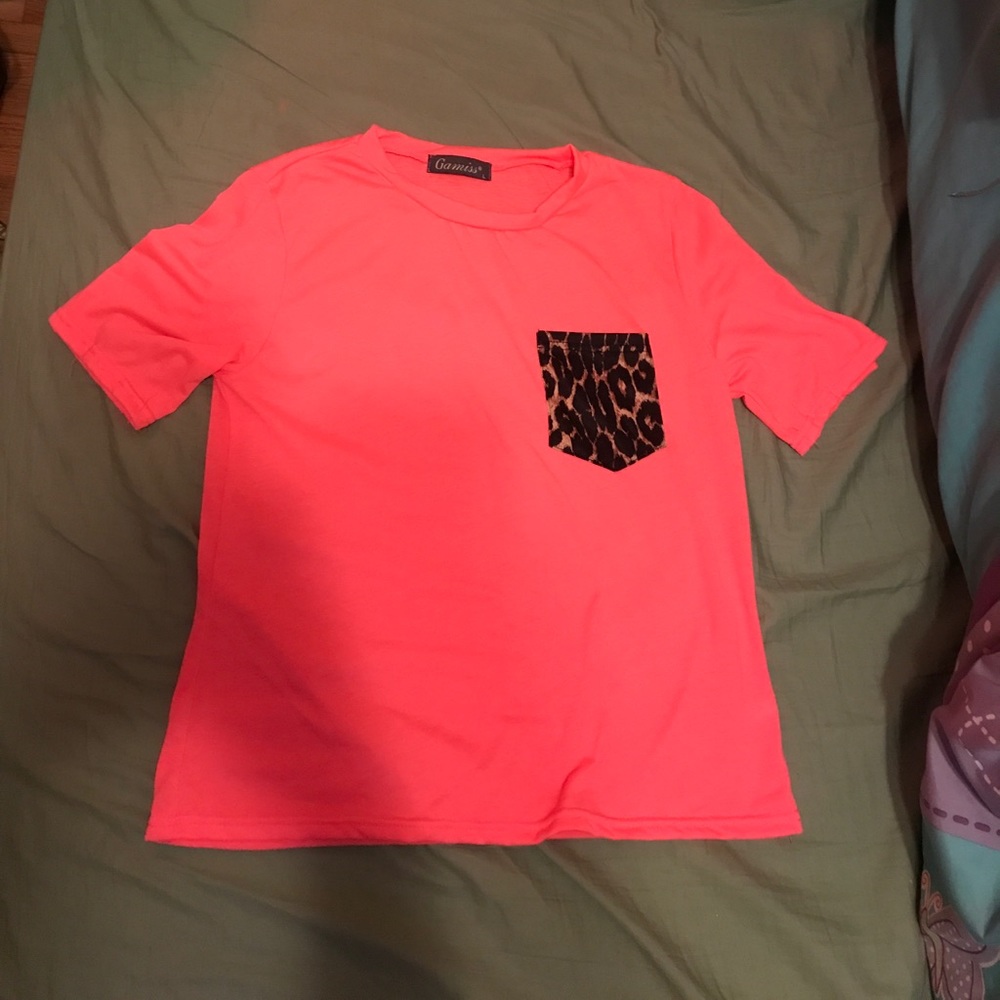 Hot pink tee with leopard print pocket.