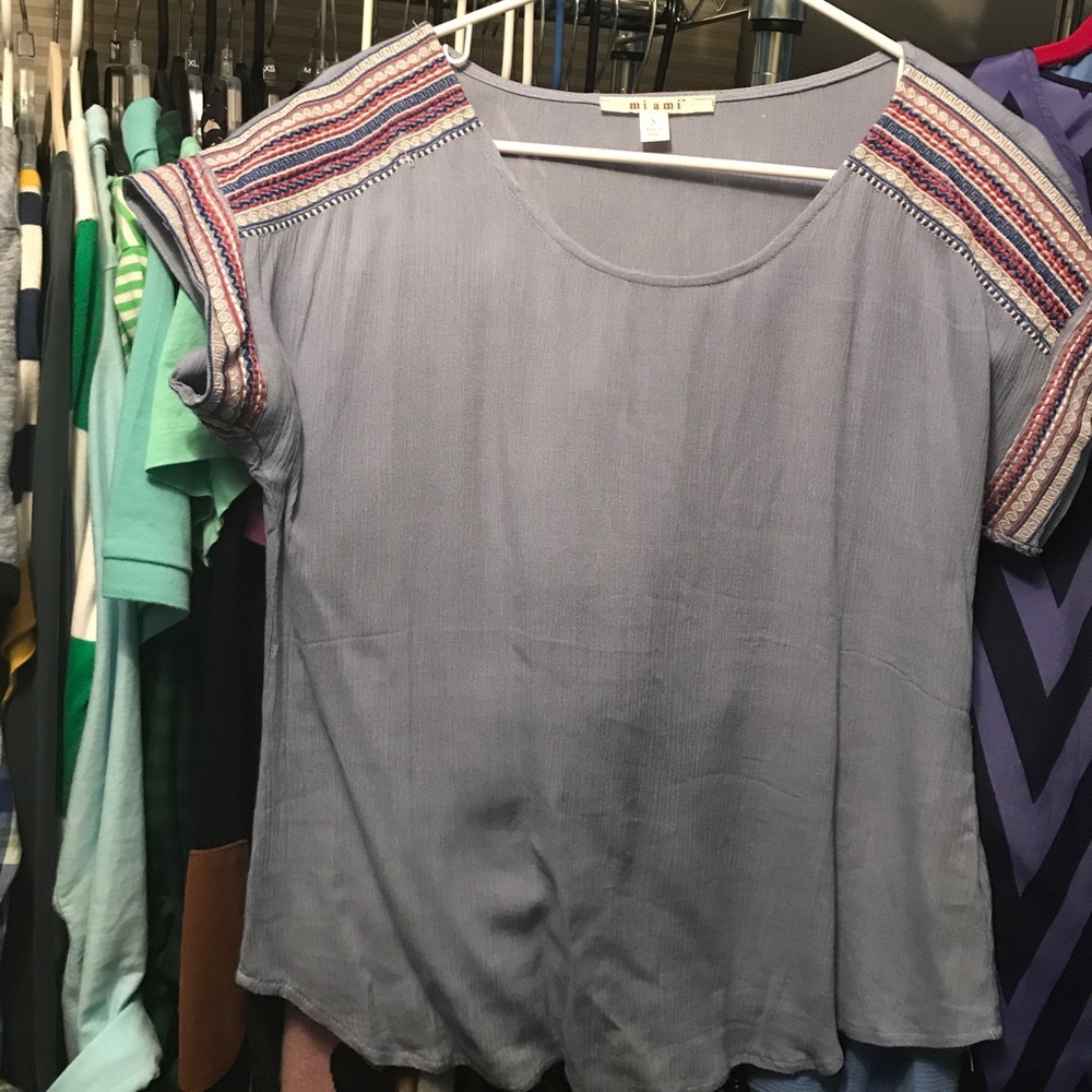 Francesca's light blue blouse