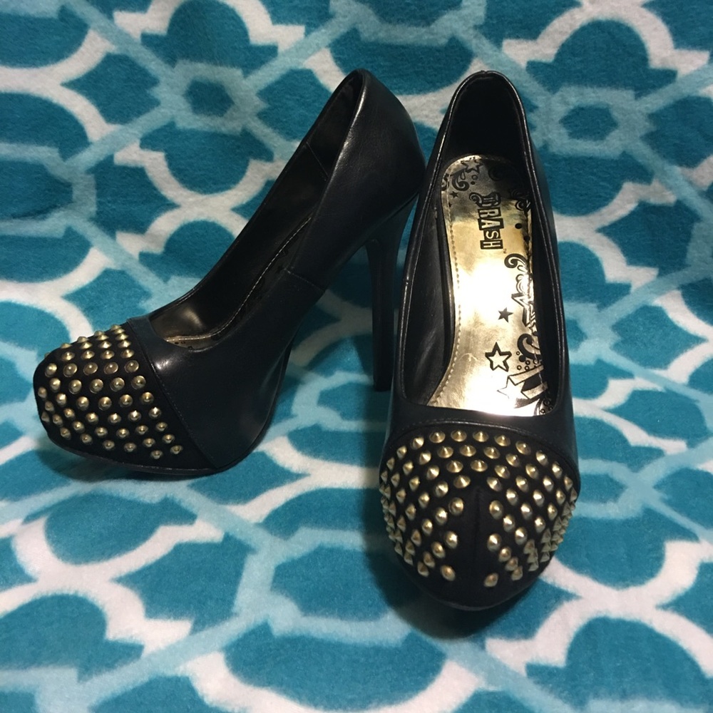 Women's black gold studded heals.