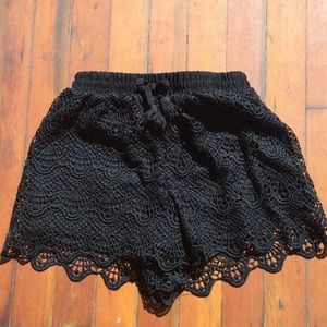 Girls black lace shorts.