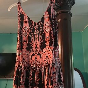 Romper with peach color and black design