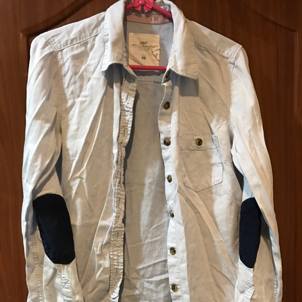 Buttoned down shirt with corduroy elbow patch