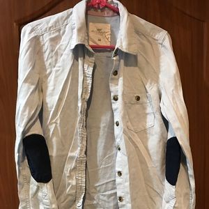 Buttoned down shirt with corduroy elbow patch