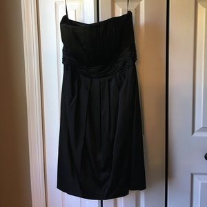 Strapless black dress with rouching details
