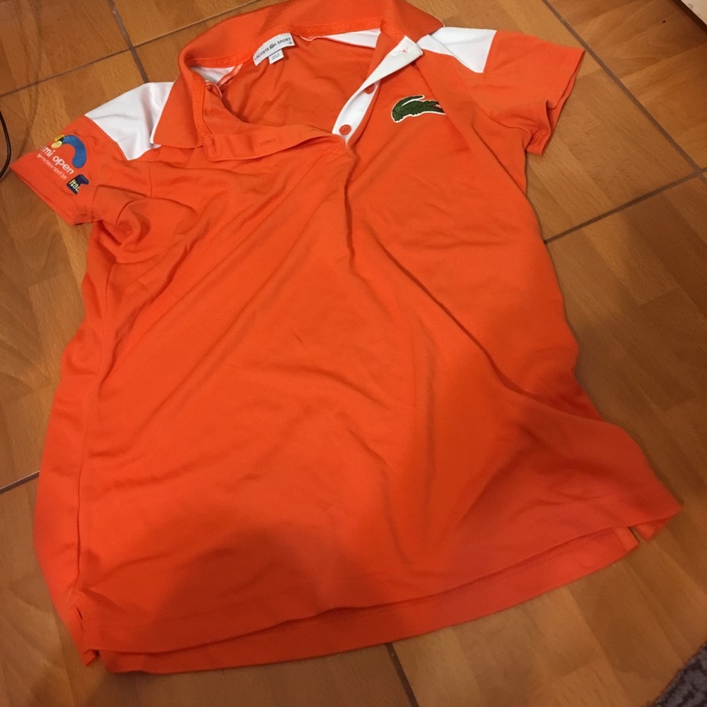 Tennis tournament shirt.