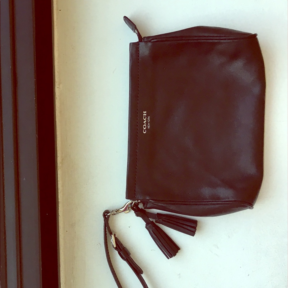COACH black wristlet with tassels and zip closure
