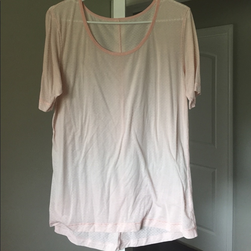 Lululemon size 6/8 light pink shirt.