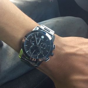 A movado Swiss carbon fiber watch