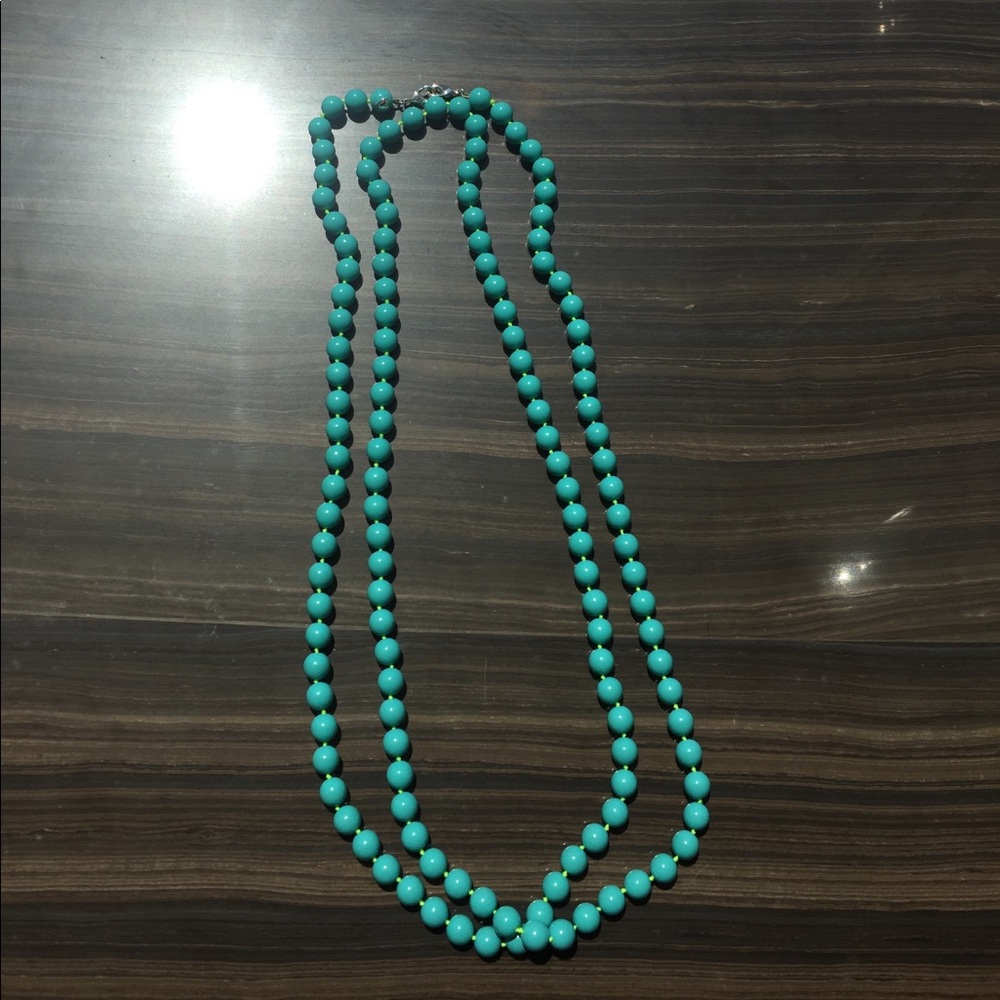 Turquoise long necklace. Heart logo. Silver clasp.